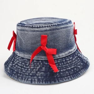 Washed denim bucket hat with red satin bows featuring a stylish vintage fisherman design