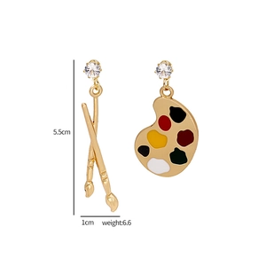 Detail view of asymmetric paintbrush earrings with dimensions 5.5cm by 1cm and weight 6.6g