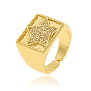 Detailed view of a gold signet ring with a sparkling star-shaped diamond inlay