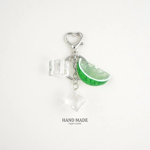 Detail of realistic lime slice and ice cube charms with heart metal keychain