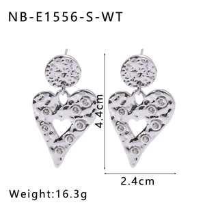 Detail view of silver heart earrings with white zircons, measuring 4.4cm by 2.4cm