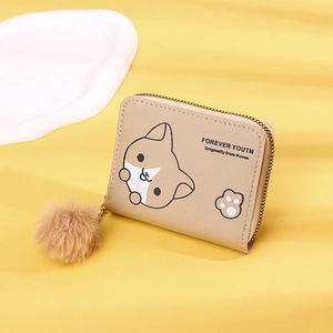 Close-up of khaki wallet with cartoon corgi, paw prints and brown pompom charm