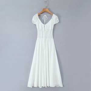 White V-neck midi dress with smocked waist, puff sleeves, and back tie detail