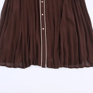 Dark brown pleated midi dress featuring white trim placket and golden round buttons