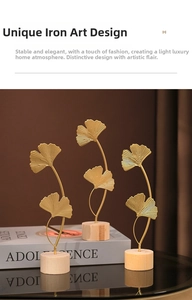 Three set of iron ginkgo leaf ornaments with matte gold texture and wooden bases