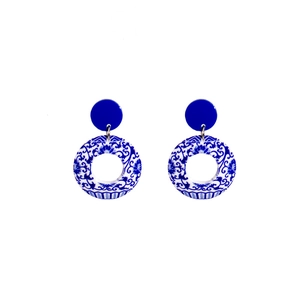 Detail of blue and white porcelain pattern acrylic drop earrings in classic Chinese style