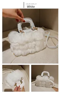 Detail view of white faux fur handbag featuring tiered plush texture and gold hardware