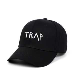 Classic black cotton baseball cap with white TRAP embroidery and adjustable curved brim