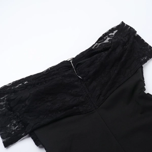 Close-up of black lace patchwork and metal zipper detail on off-shoulder jumpsuit
