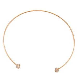 Minimalist gold stainless steel choker featuring hexagonal ends with sparkling crystal inlay