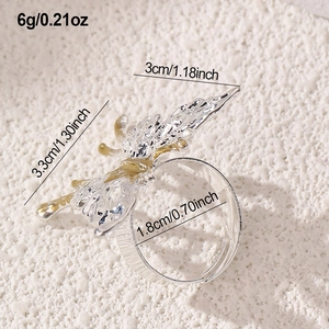 Macro shot of silver and gold plated butterfly ring with precise dimension callouts