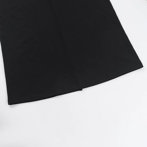 Close-up detail of the hemline stitching on this black mesh拼接 bodycon dress