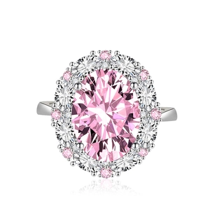 Elegant pink oval gemstone ring with double halo diamond setting on silver band