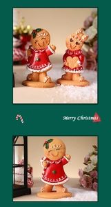 Close-up of Christmas gingerbread man resin figurines with festive artificial snow