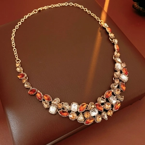 Detail of vintage teardrop necklace with amber crystals on leather display box