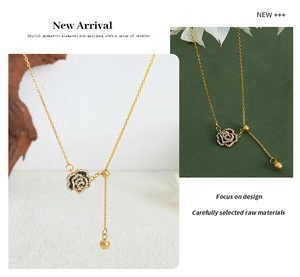 Detail of adjustable rose pendant necklace with crystal zircons and black enamel