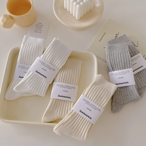 Vertical striped cotton mid-tube socks in a set of neutral tones for cozy daily wear