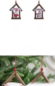 Detailed view of 12x9cm Noel and Xmas wooden house ornaments on a Christmas tree