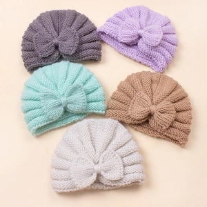 Detail of 5 knit baby turban hats with large bows in grey, purple, mint, khaki, and light grey