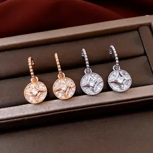 18K gold plated silver earrings with pavé star round pendants in rose gold and silver