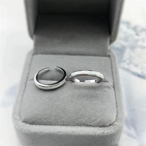 Detailed close-up of a two-piece S925 silver open toe ring set with white opal stone inlay