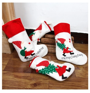 Set of 4 white Nordic style embroidered Christmas stockings with Santa and tree motifs