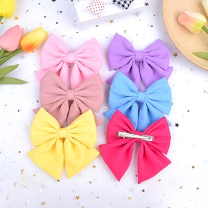 Set of large satin bow hair clips in vibrant candy colors with metal alligator base