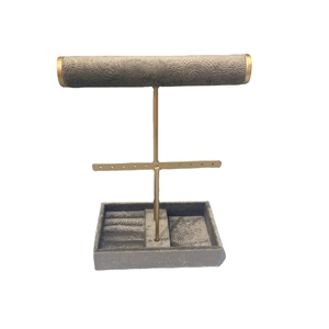 Three-tier jewelry display stand with golden metal frame and gray velvet tray