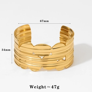 Detailed size view of wide textured gold open bangle showing width 34mm and diameter 67mm