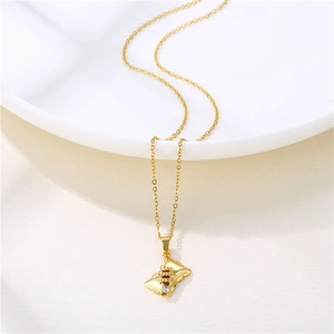 Gold stainless steel rectangle pendant necklace with zircon on white ceramic tray