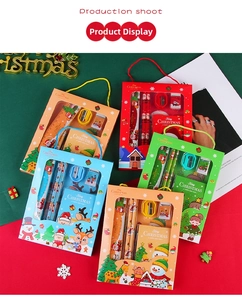 Detailed Christmas stationery set including pencils, ruler, and notebook with cartoon motifs
