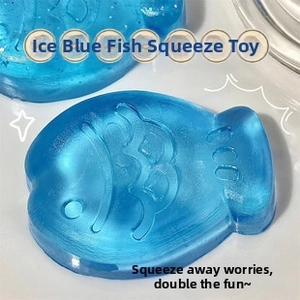 Blue translucent taiyaki stress relief toy with scale texture and jelly-like material