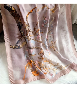 Detail of silk scarf featuring Van Gogh style almond blossom print on soft pink fabric