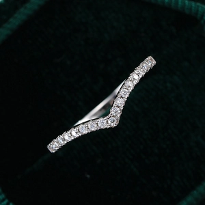 Elegant V-shaped 925 sterling silver crown ring with pavé moissanite stones on velvet