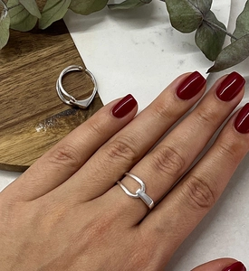 Detail of S925 sterling silver geometric interlocking ring with adjustable open band