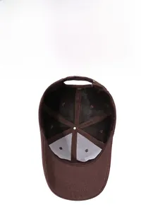 Detail of deep brown baseball cap interior showing breathable mesh and metal buckle