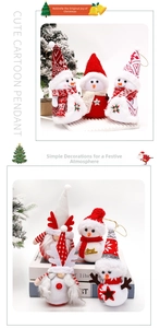 Close-up of Christmas snowman plush doll with Merry Christmas embroidery and red hat