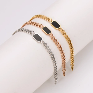 Three-color stainless steel Cuban chain bracelets with black square inlay on white pillars