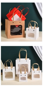 Detailed view of smiley face paper gift bags with transparent windows in various sizes