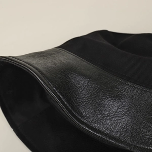 Women's black cotton fisherman hat with leather brim and minimalist stitching detail