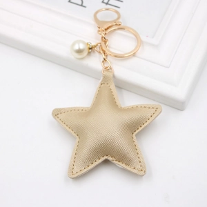 Champagne gold star keychain in PU leather with white pearl and gold lobster clasp