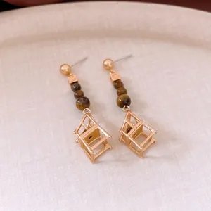 Elegant gold drop earrings with tiger eye beads and unique geometric chair pendant