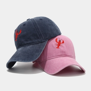 Distressed wash cotton baseball cap with red lobster embroidery in navy blue and pink