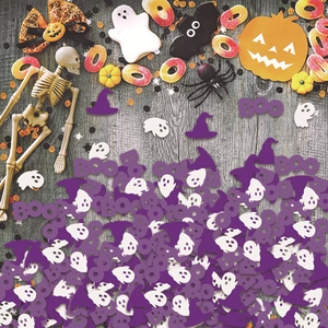 Halloween wizard hat and ghost confetti table decor with purple BOO letters on wood