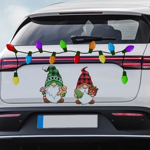 Detail of magnetic Christmas gnome stickers and colorful bulb decals on a white SUV trunk