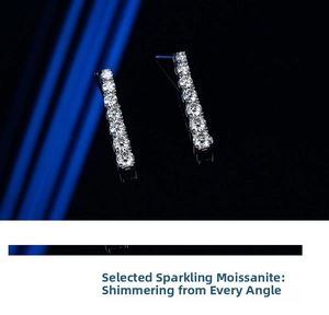 Macro shot of sparkling Moissanite long tassel earrings set in a polished silver base