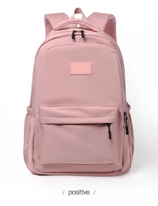 Front view of pink school backpack with zippered pockets and breathable mesh back padding