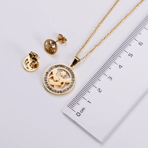 Detailed view of gold plated jewelry set with measurements showing dragonfly pendant size