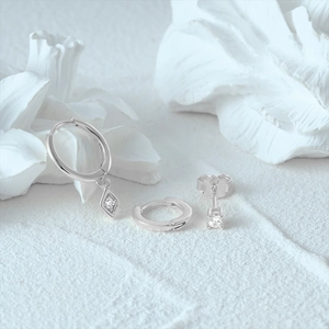 Detailed macro view of S925 sterling silver hoop earring set with cubic zirconia stones