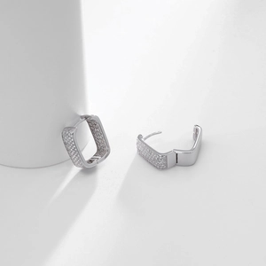 Macro detail of silver rectangular earrings with micro-pave cubic zirconia inlay